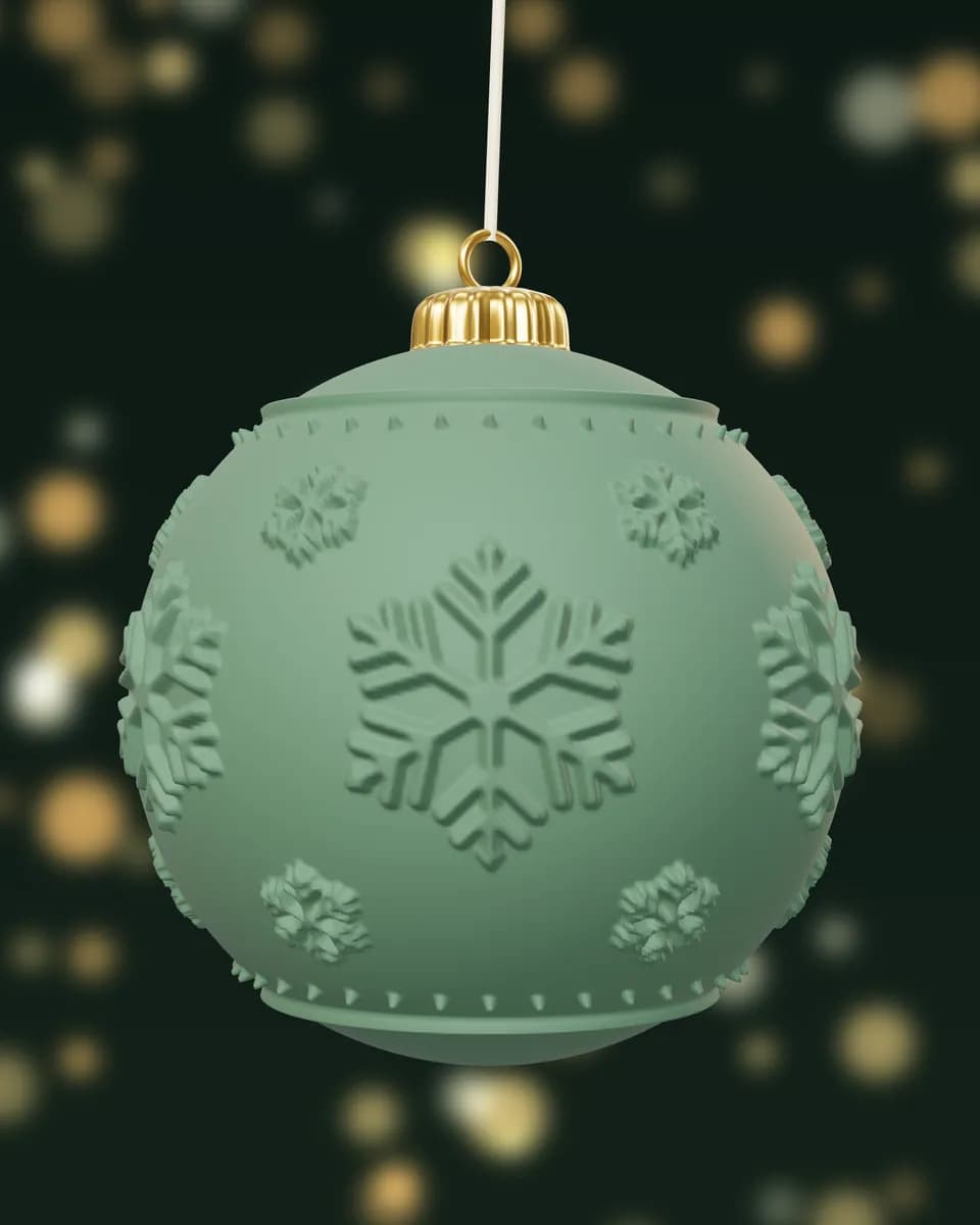 A matte green bauble with raised snowflakes and no glare