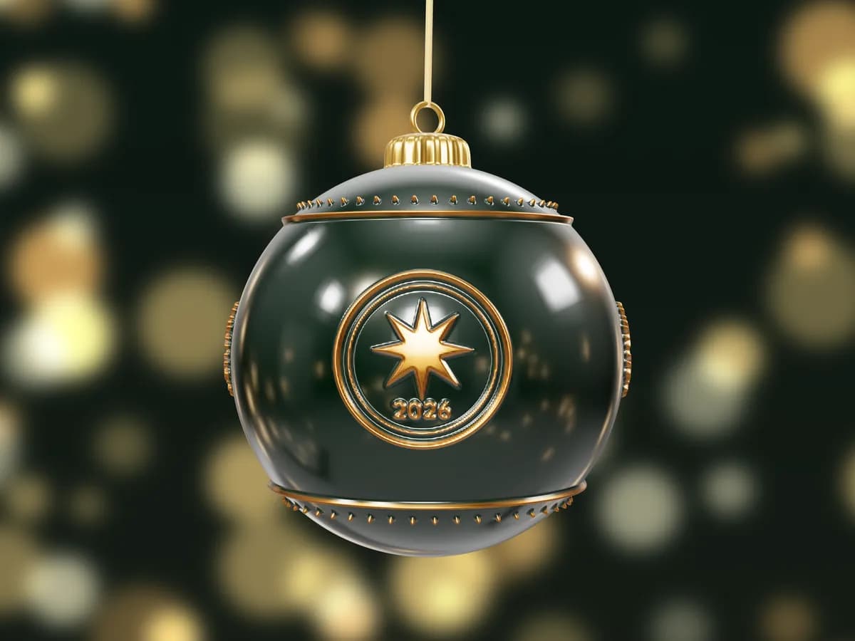 A glossy dark green bauble with a gold star emblem and 2026 in relief