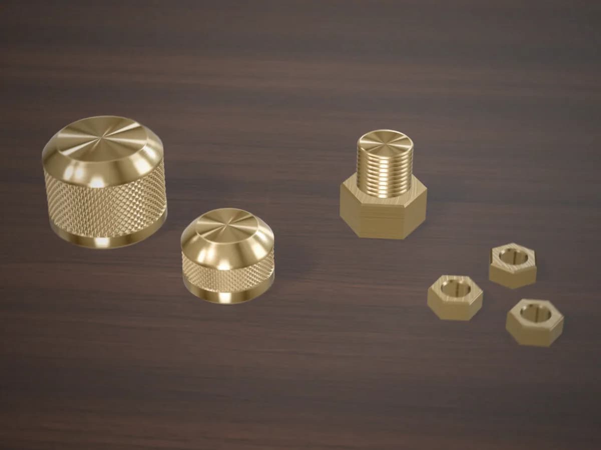 Machined brass hardware on a walnut bench: knurled knobs, hex nuts and a threaded hex fitting