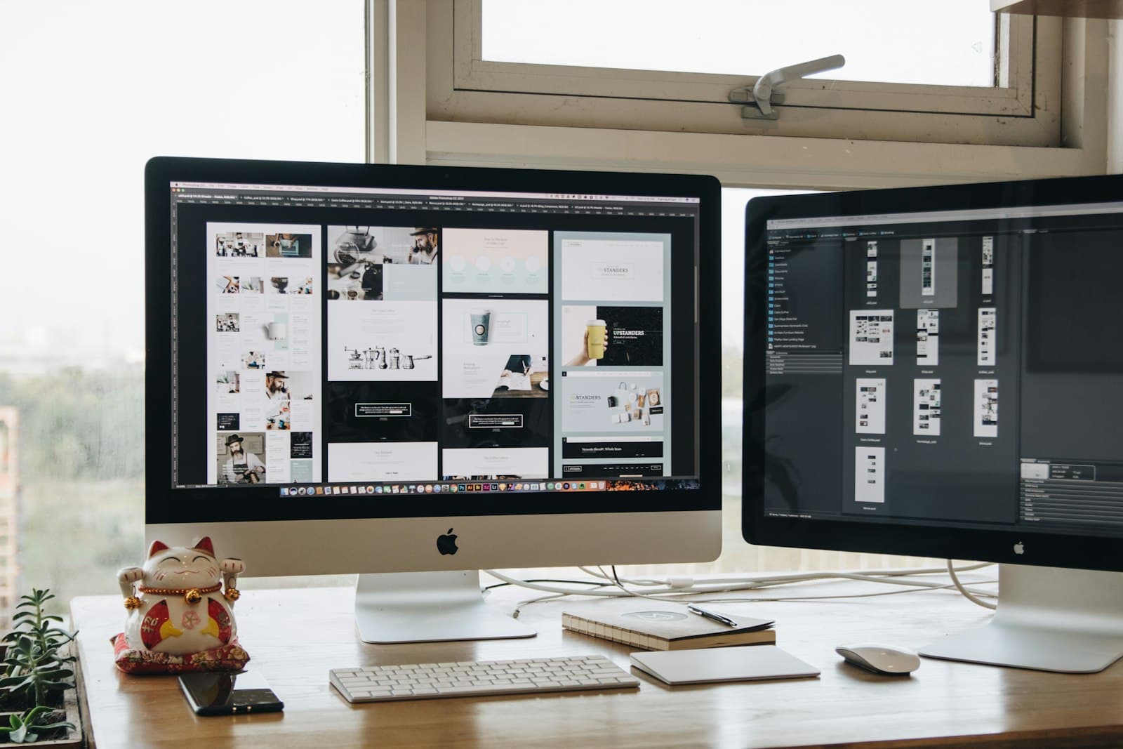 Two monitors showing portfolio layouts