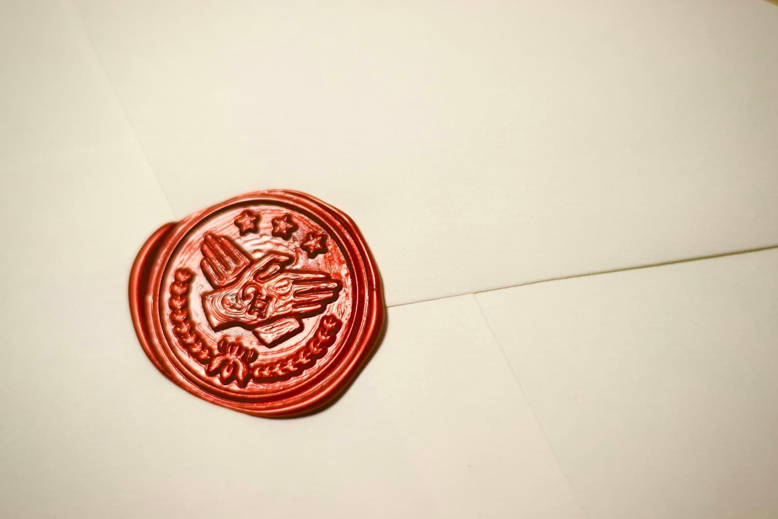 Close-up of a detailed red wax seal