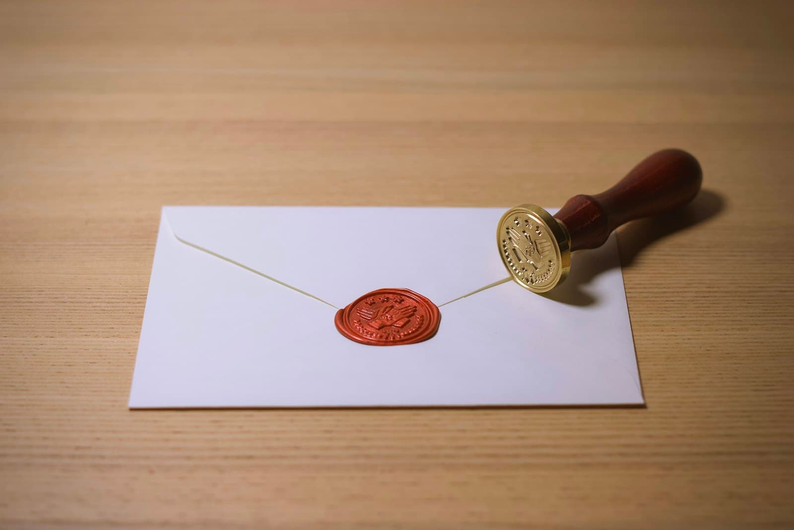 A seal stamp beside the wax impression it made