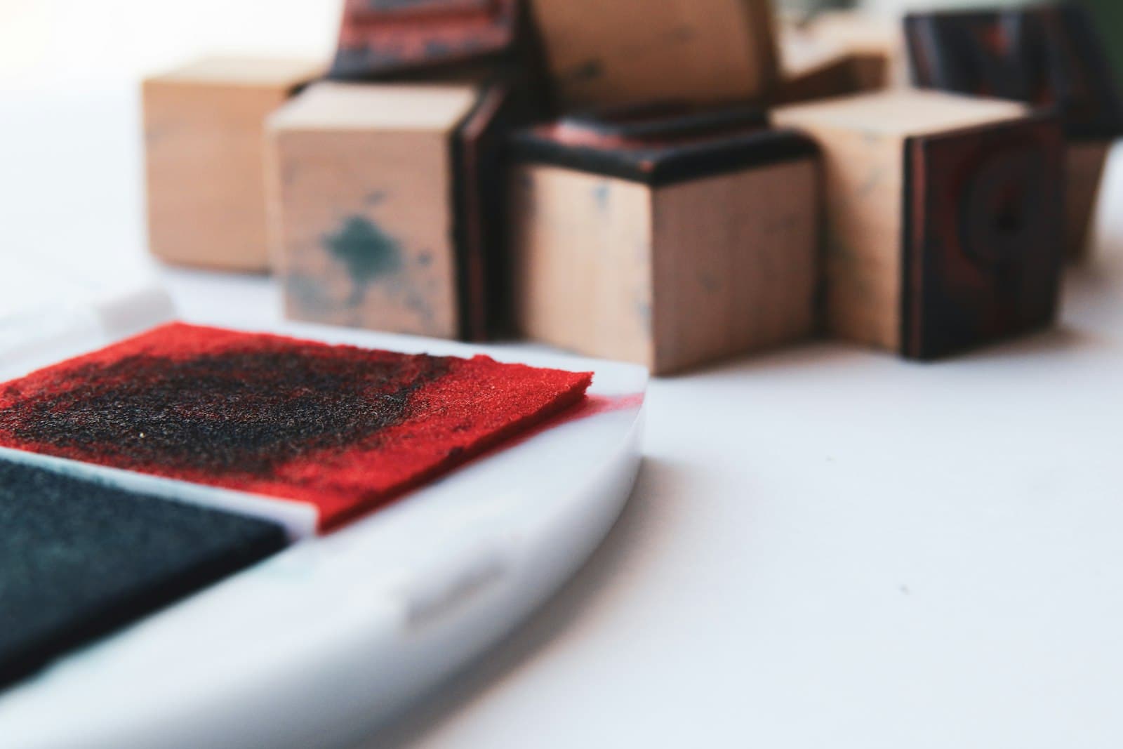 Wooden stamps beside an ink pad