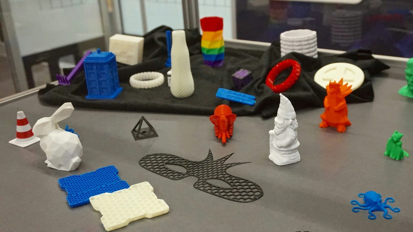 A table of small 3D-printed toys and figures