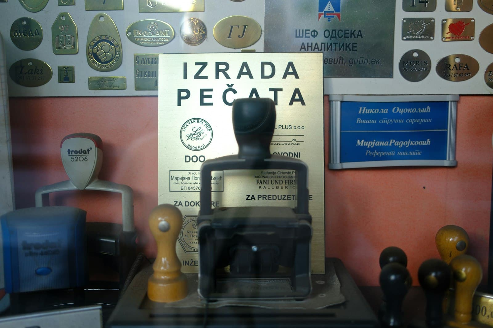 A stamp-maker's window full of stamps and plaques