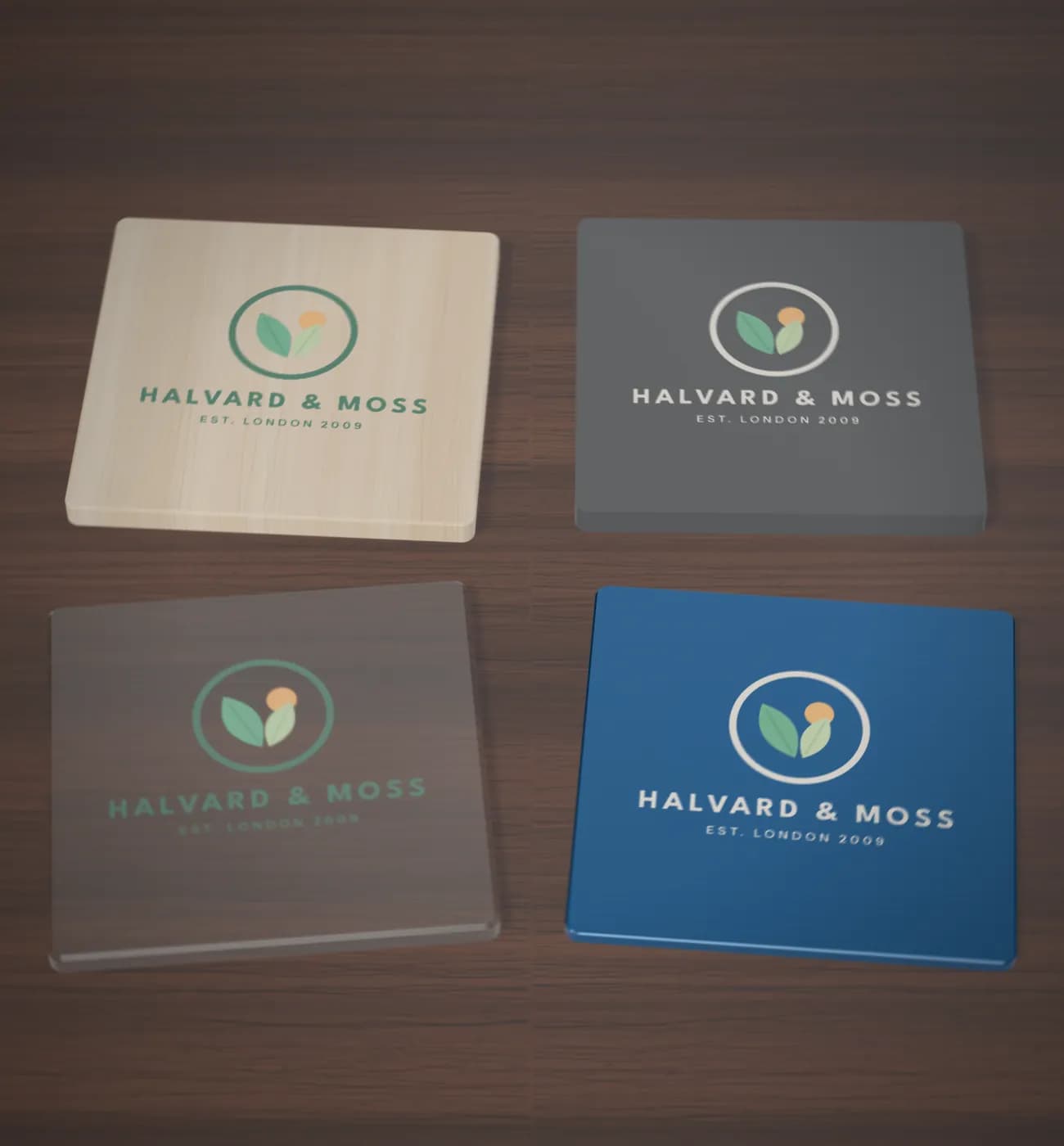 One logo UV printed on four materials: birch plywood, slate, clear acrylic and blue anodised aluminium