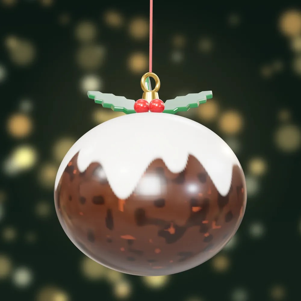 A hand-painted Christmas pudding bauble with dripping white icing, holly leaves and red berries