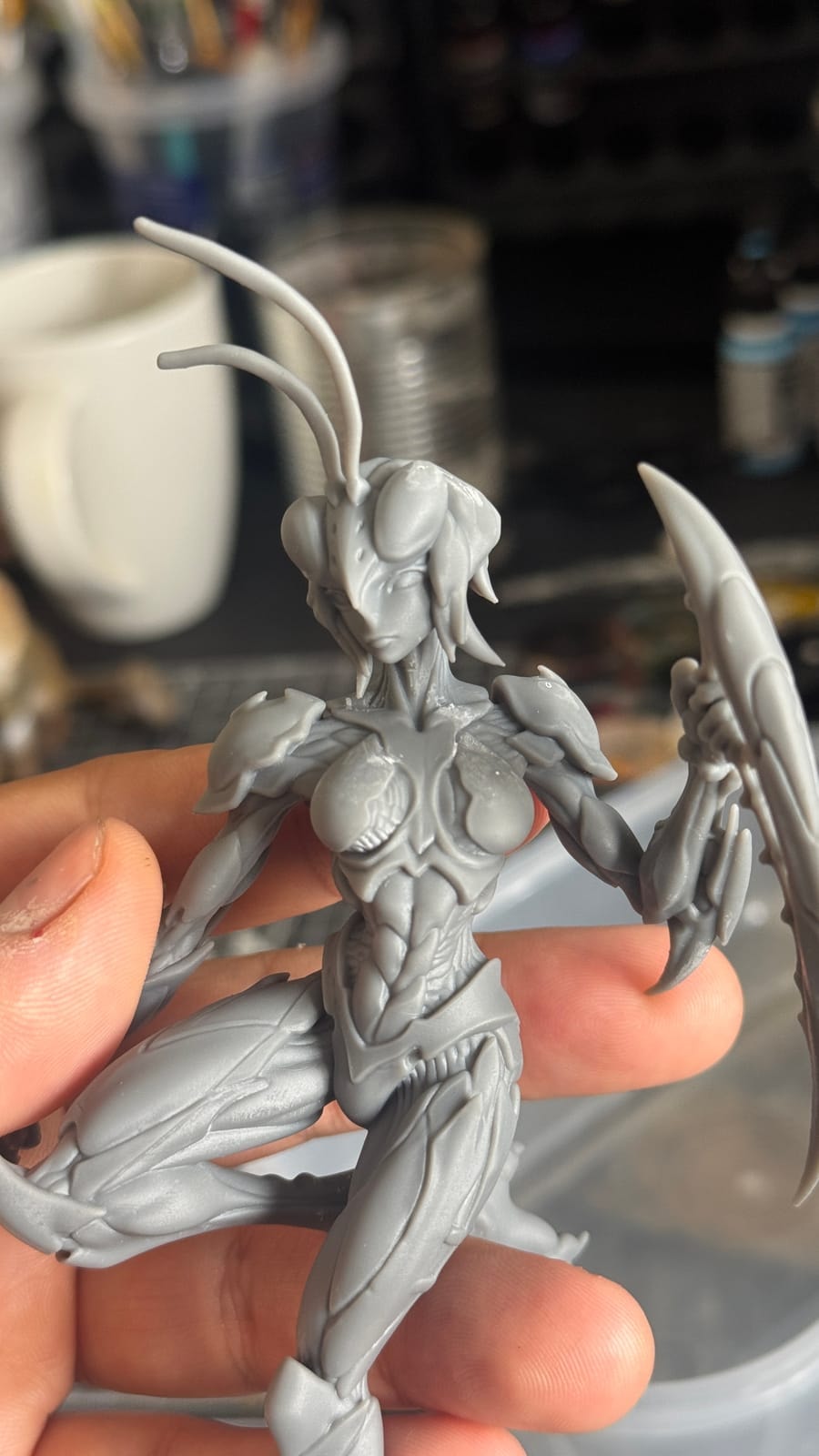 Close-up of the unpainted insect warrior print in the hand