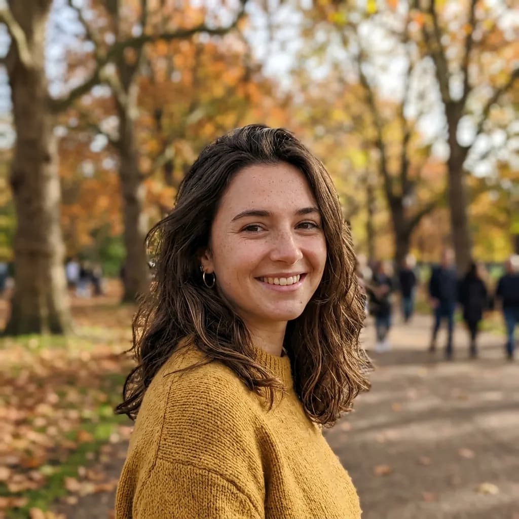 Example photograph: a smiling young woman in a yellow jumper