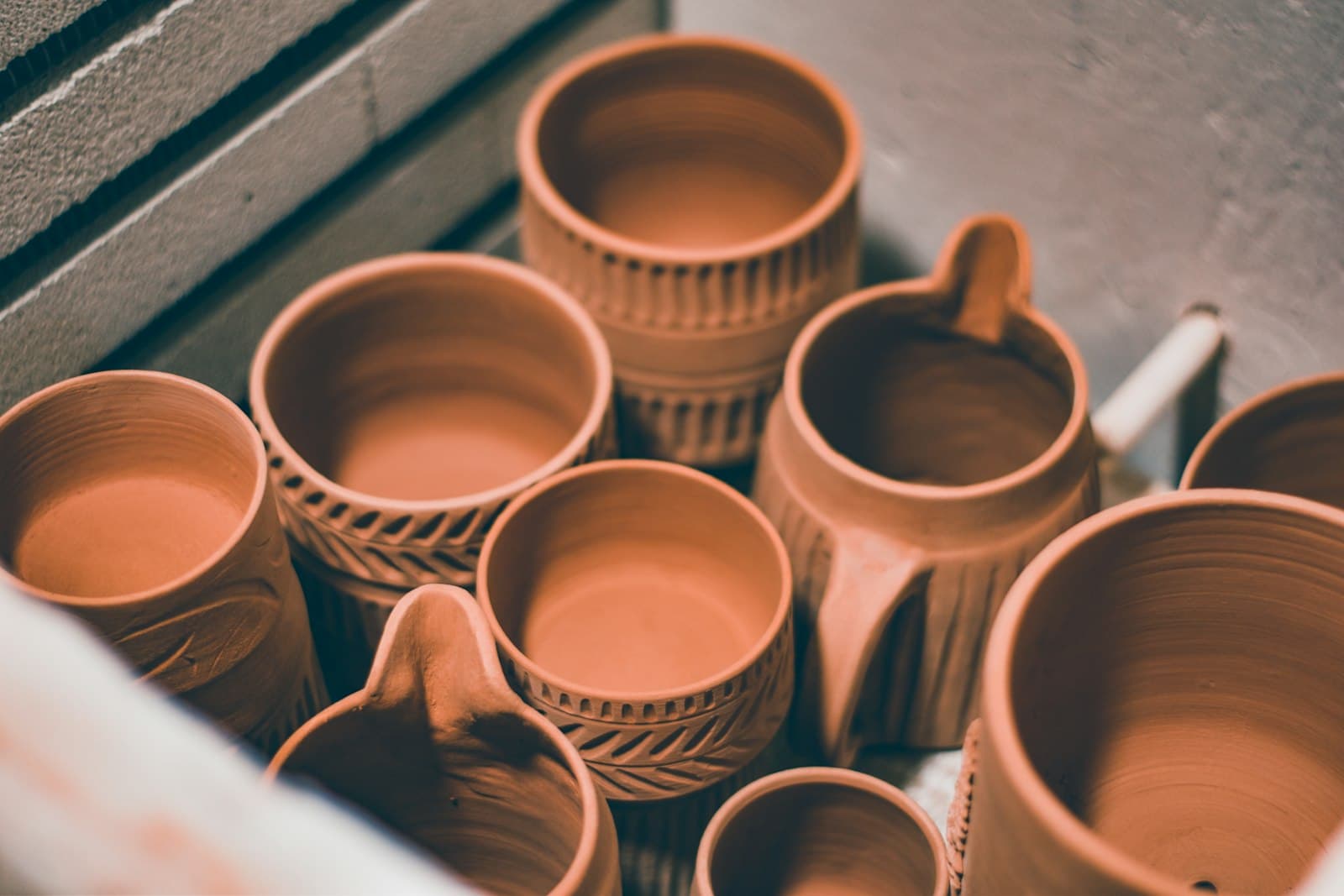 Terracotta cups with pressed patterns