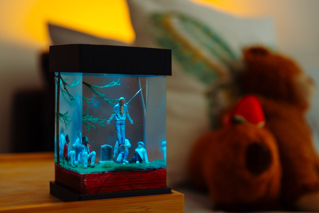 Miniature diorama Stranger things, Max Mayfield levitating, with people around a grave in a glass epoxy lamp on a dark background,  gift for stranger things fans